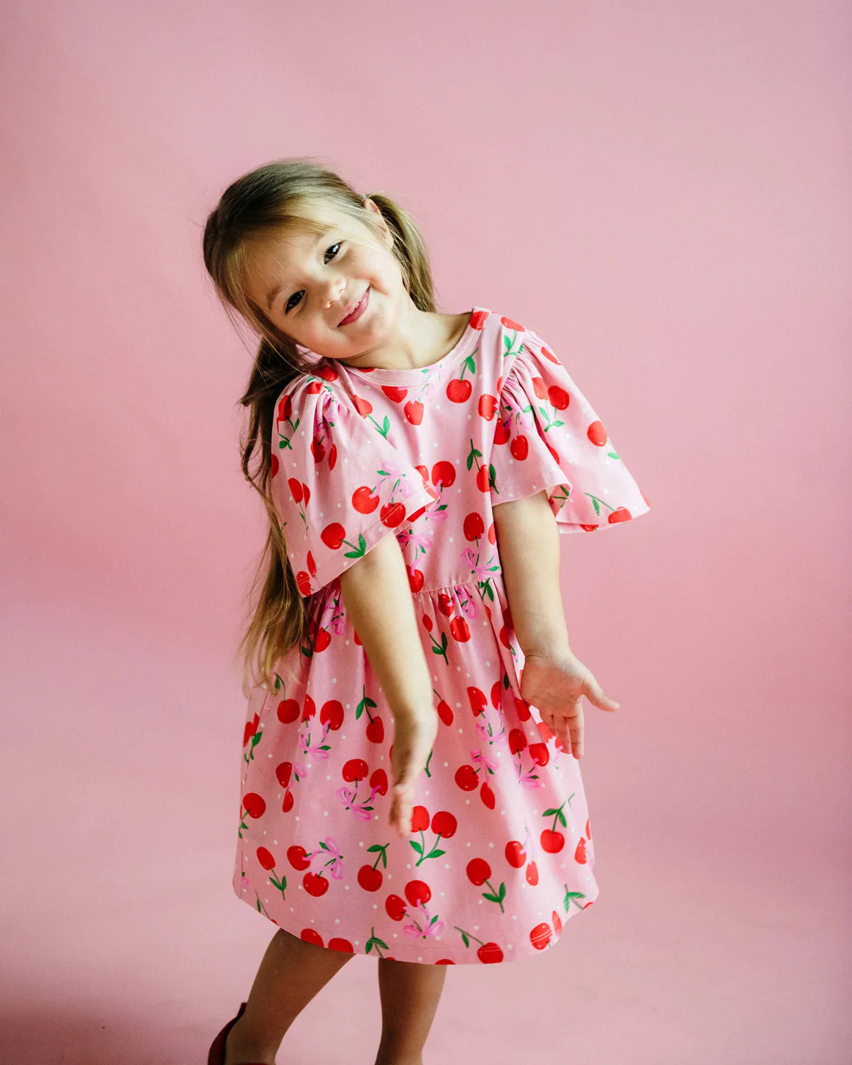 Rock your baby cherry polka dot dress in cherry pink