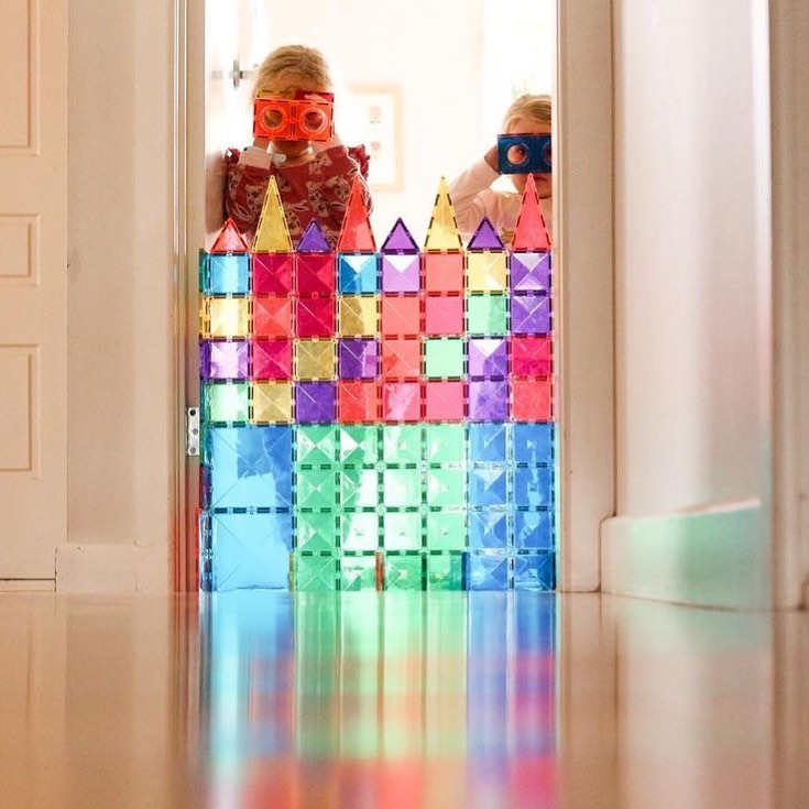 kids playing behind a connetix wall 