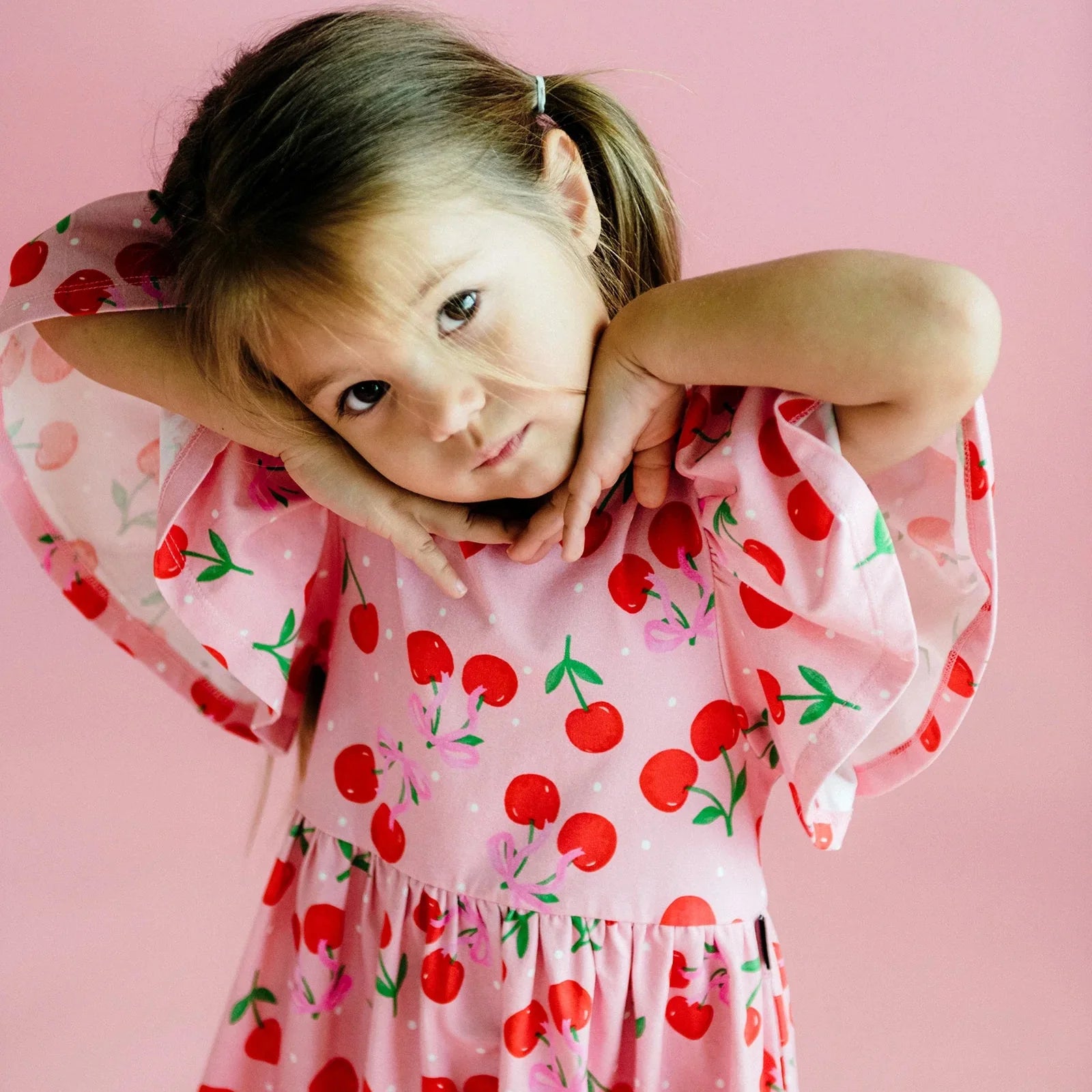 Rock your baby cherry polka dot dress in cherry pink