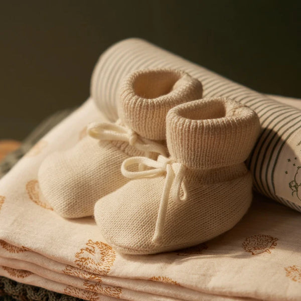 Nature Baby Merino knit drawstring booties in cream