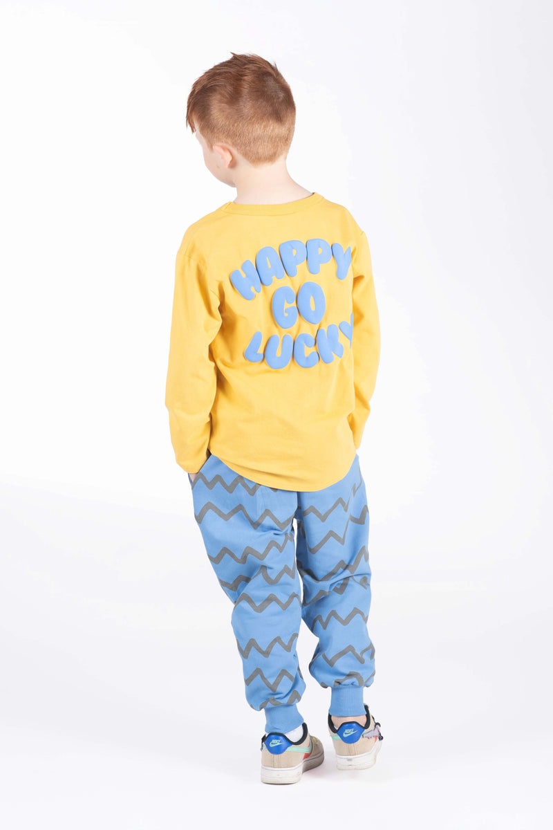 Rock your baby Happy Go Lucky LS Tee in Mustard