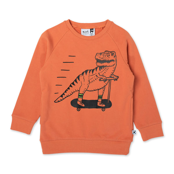 Minti Scooting Dino Furry Crew in Burnt Orange