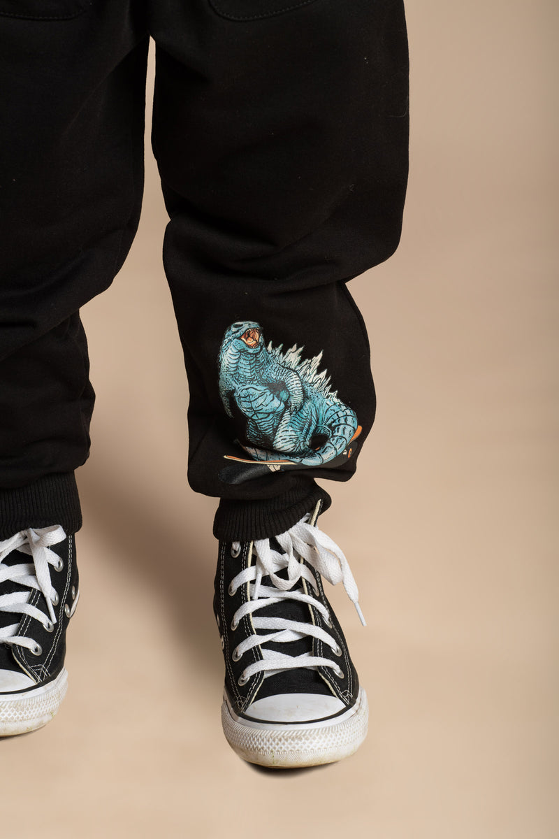 Rock Your Baby Godzilla Skate Trackpants in Black and Teal