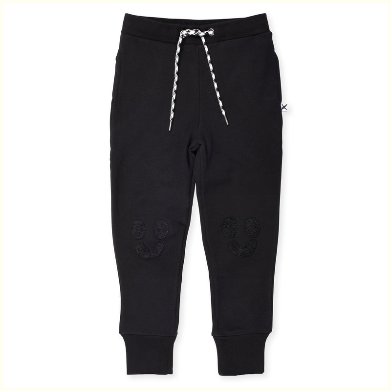 Minti happy face furry trackies in black