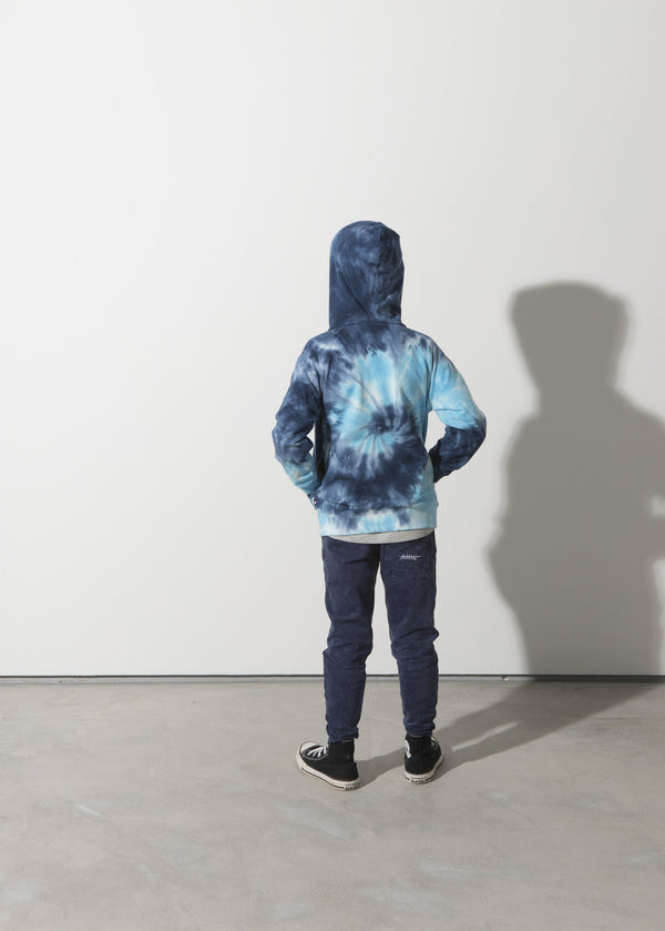 a boy faces the back showing the back print on the Minti long sleeve spiral furry cotton fleece hoodie in blue