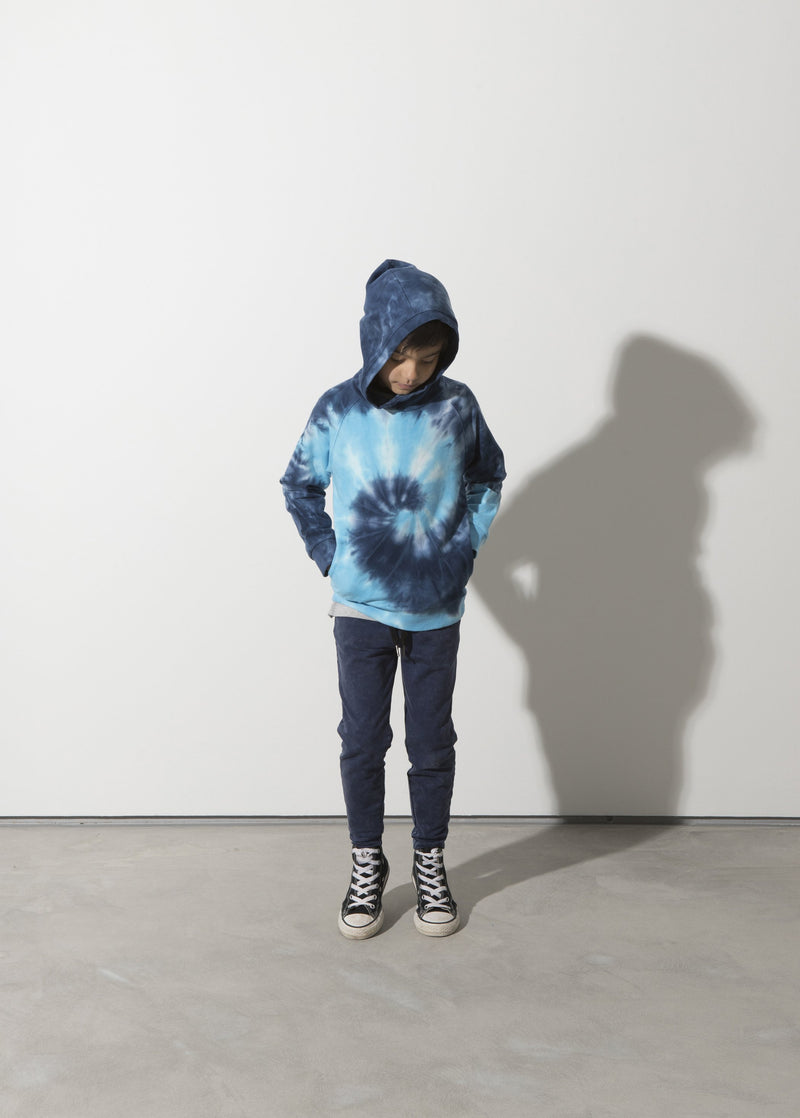 a boy faces the front wearing the Minti long sleeve spiral furry cotton fleece hoodie in blue showing how the hood sits on the head